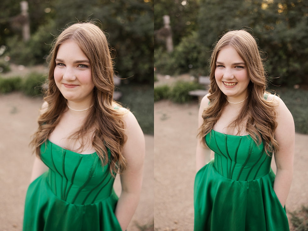 Young woman in a green dress stands outdoors, looking at the camera with a gentle smile. Lush greenery forms the background.