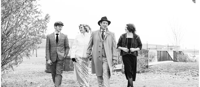 Family walking in black and white