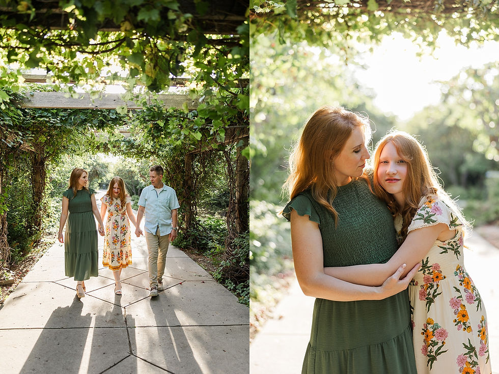 A family of three walks under a vine-covered pergola. The mother and daughter embrace, bathed in warm sunlight, conveying a peaceful mood.