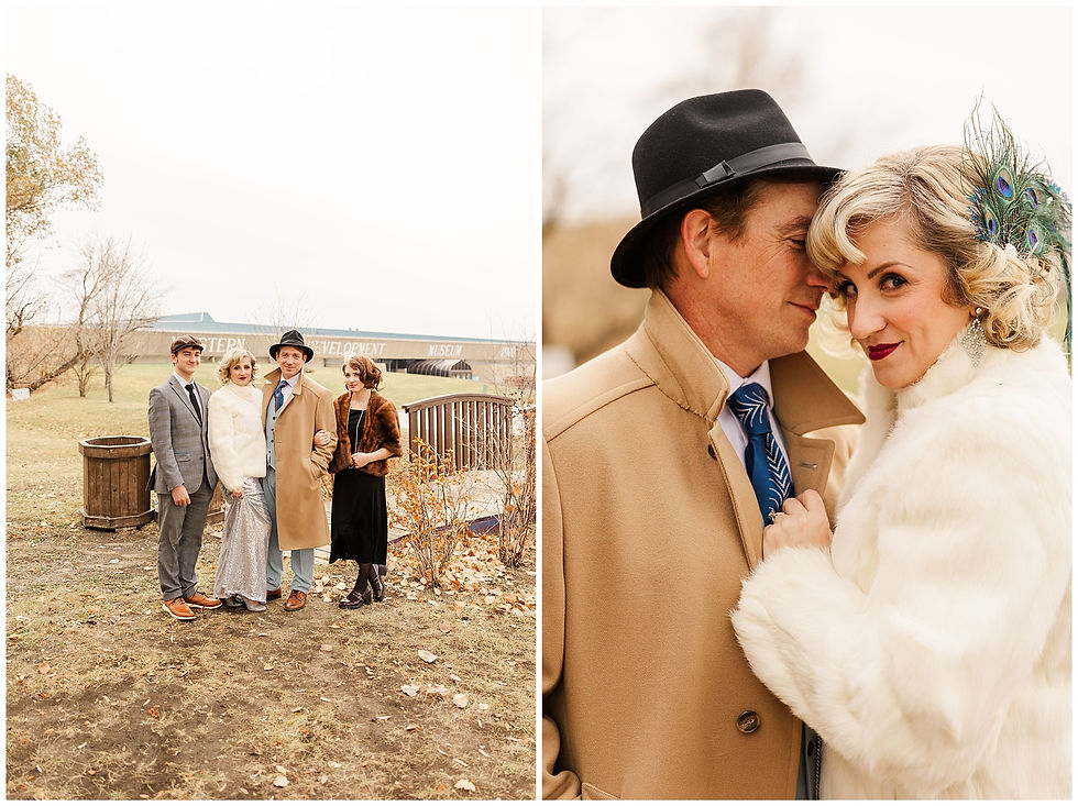 People in vintage attire pose outdoors; one embraces another, both wearing hats and coats. Autumn backdrop with muted colors.