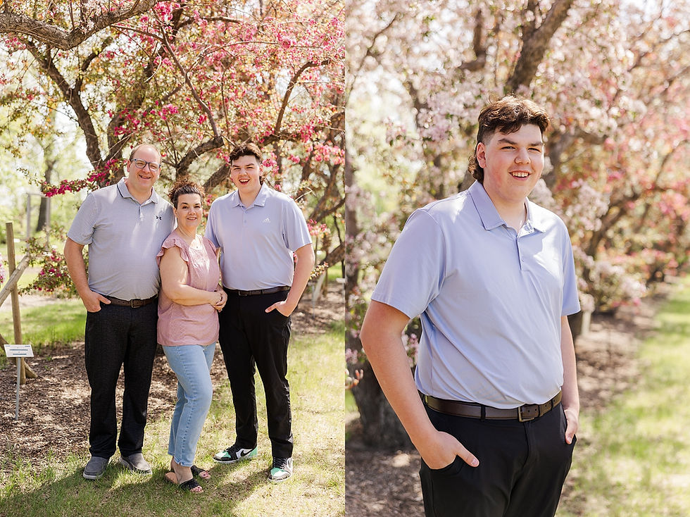 Family portrait by blooming trees. Three people smile, wearing casual clothes. Sunny day, vibrant pink blossoms in the background.
