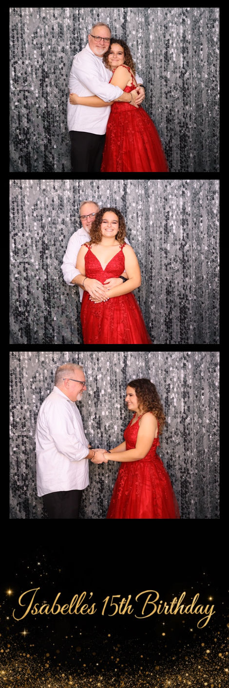 Couple posing in front of a silver sequin backdrop.