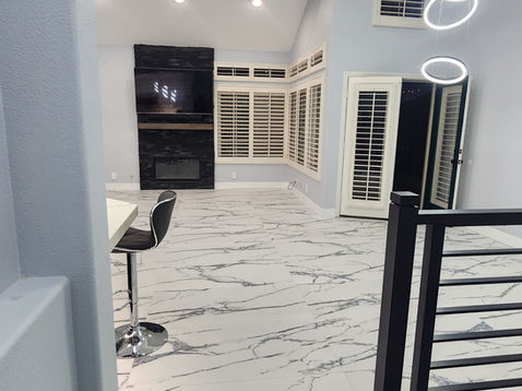 Modern interior with marble floor and stylish lighting.