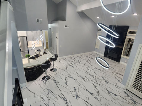 Modern interior with marble floor and circular lights.