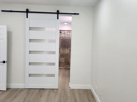 White sliding door in a minimalistic room.