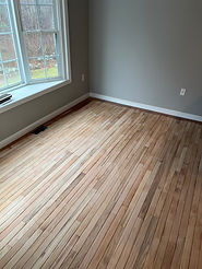 Hardwood floors sanded down for finishing