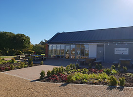 The new café building ithin its landscaped setting
