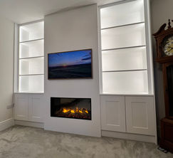 bespoke media wall with a cupboard to the side and a Gazco eReflex 110RW Fire in Witham.