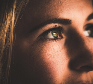 Standing behind actual prison bars will