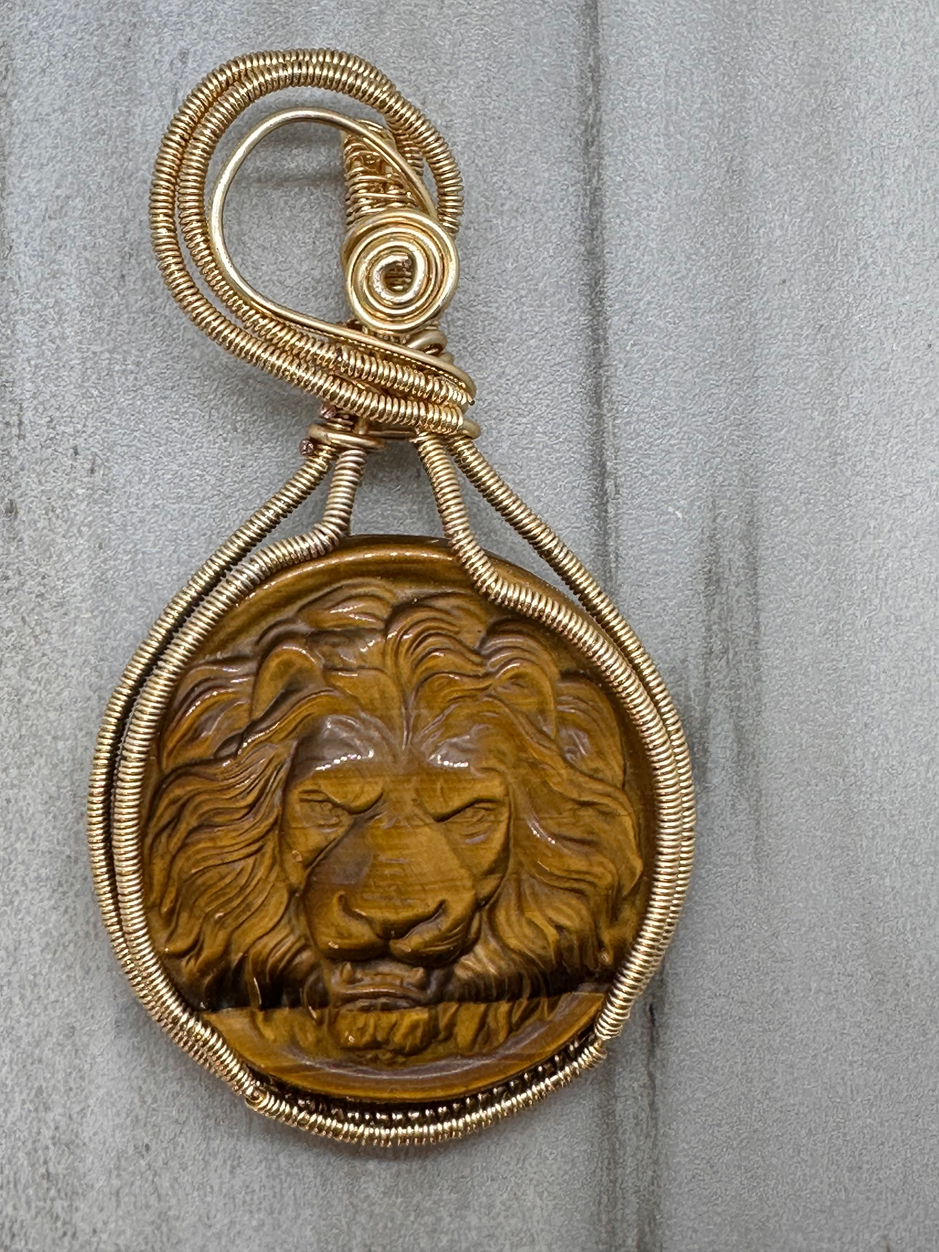 Lion Engraved Tigers Eye Pendant
