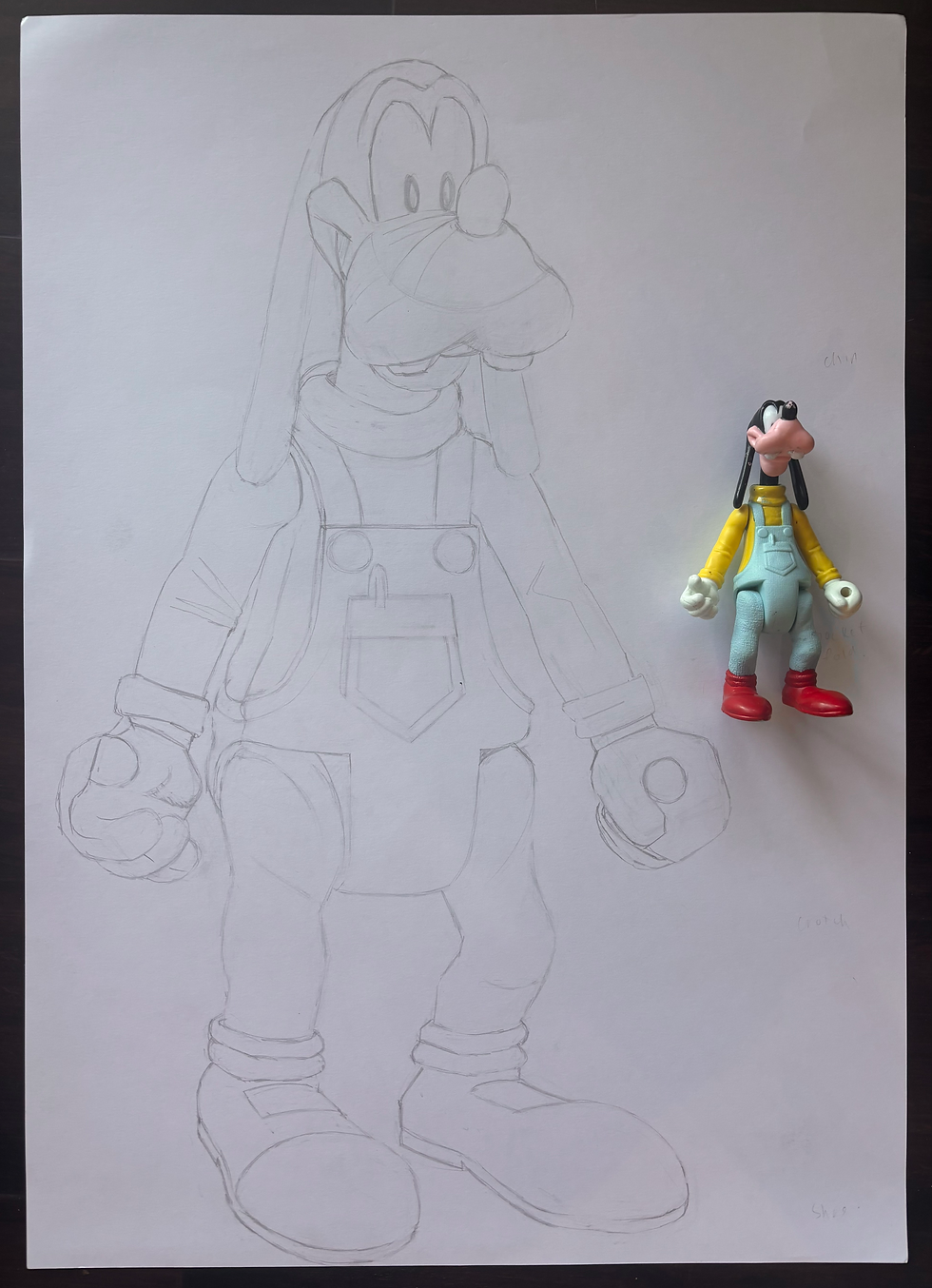 Goofy toy figurine and observational drawing