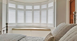 Full height curved bay window shutters
