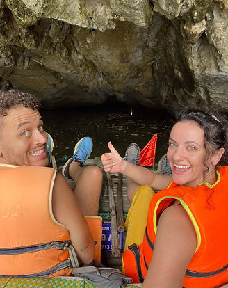 Jack on a boat heading into a cave