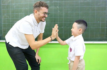 Jack hi fiving a student