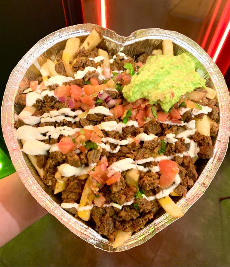 Giant plate of fish tacos in the heart shaped container