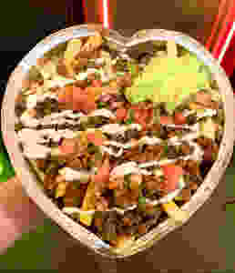Giant plate of fish tacos in the heart shaped container