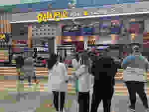 Customers viewing mexican food menu at Baja Cali locatin #7- Santa Anita Mall