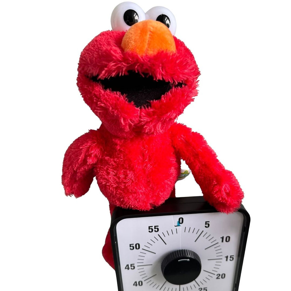 Red plush toy holding a square timer set to around 58 minutes. The background is plain white, creating a playful and cheerful mood.
