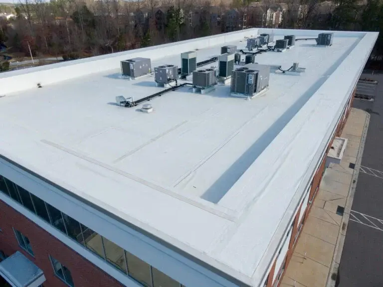 what-is-tpo-roofing-close-up-of-commercial-brick-building-with-new-tpo-roofing-and-hvac-un