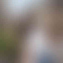 Smiling girl with curly brown hair