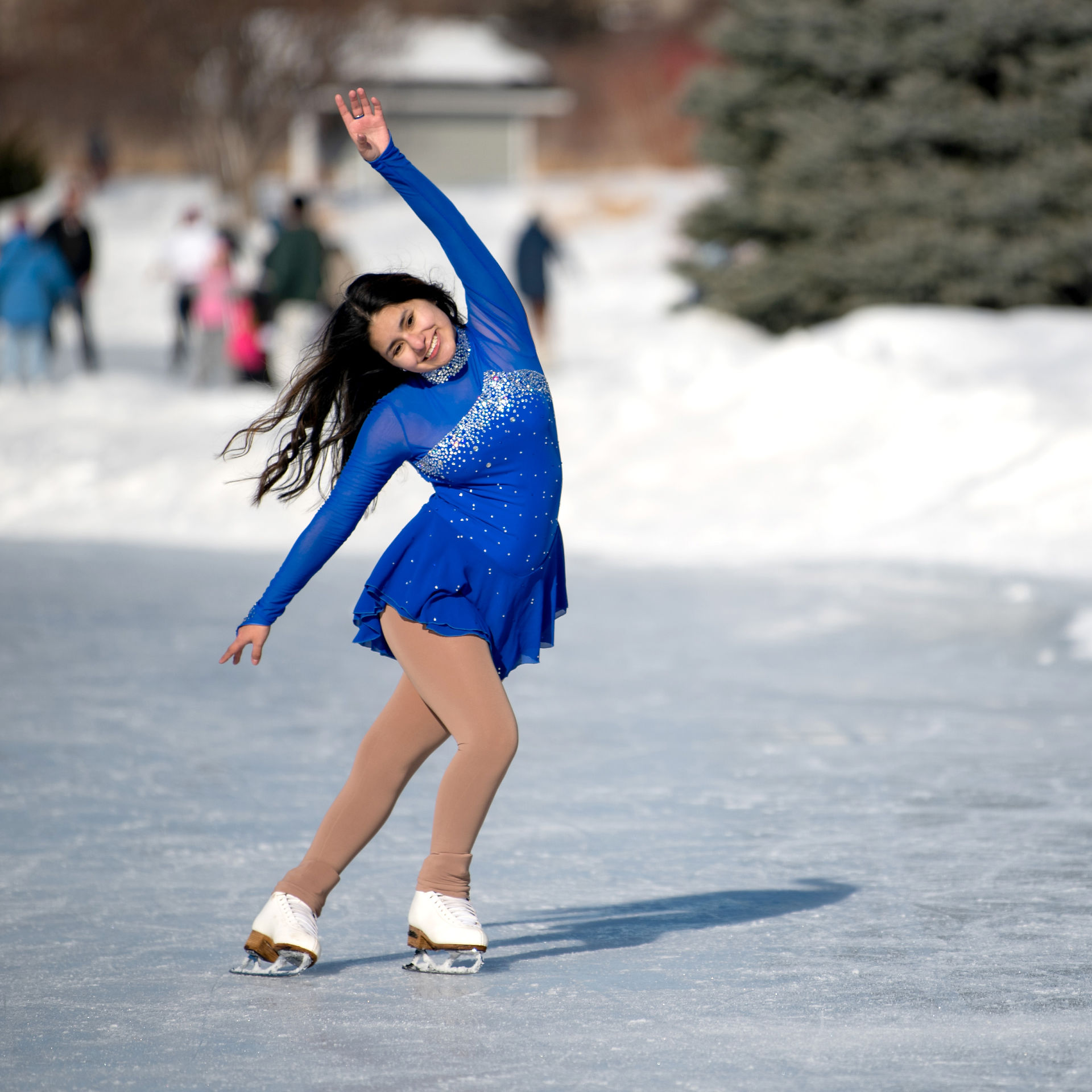 Girl in blue ice skating