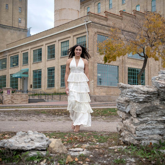 Smiling girl in long white dress