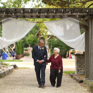Groom and his mom walking up the aisle