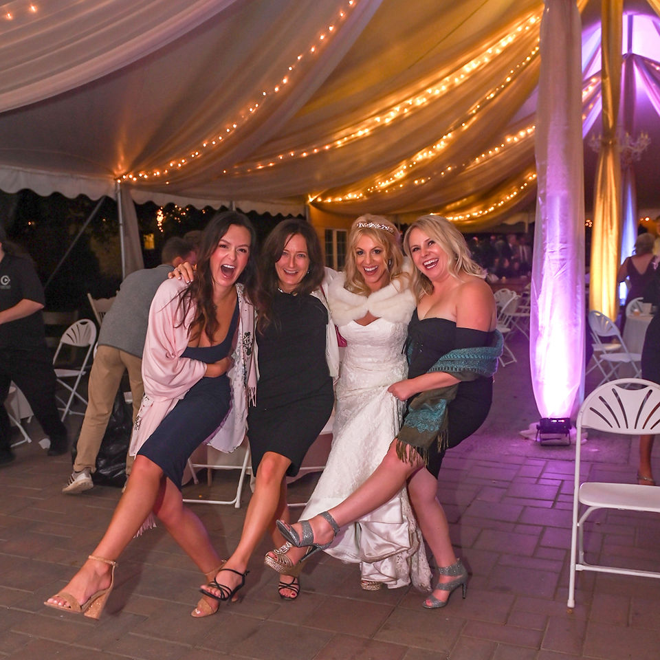 Bride and wedding guests kick up their heels