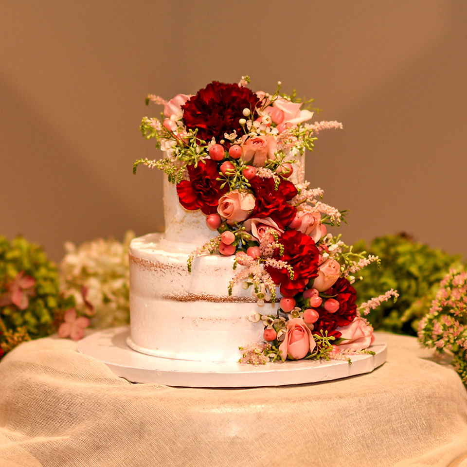Wedding Cake with Red and Pink Flowers