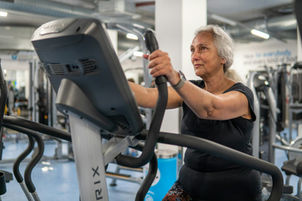 An older woman training at the gym