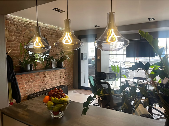 The Construction Collective Ltd office in Barnet, featuring a modern industrial interior design with exposed brickwork, bespo