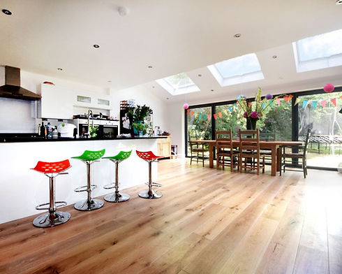 Open plan kitchen extension in Barnet North London with skylights and dining area