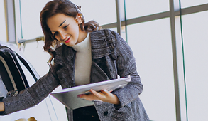 DALL·E 2023-02-22 16.05.21 - woman inspecting a car dealership photo.png