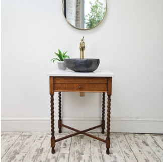 vintage vanity unit with a river-stone basin, front view