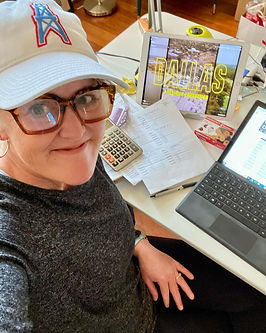 Amy W.D. writing about college football while watching the Dallas television program