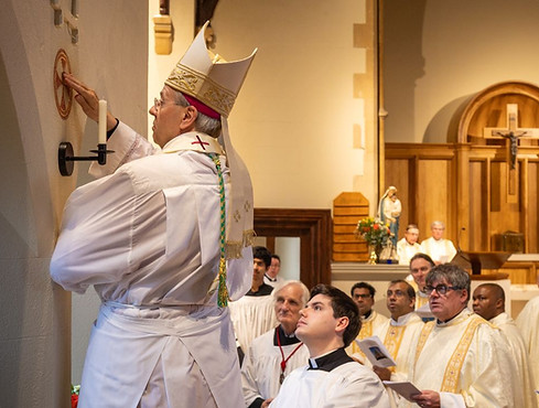 Annointing the Consecration crosses.jpg