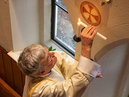 James lighting the candles.jpg