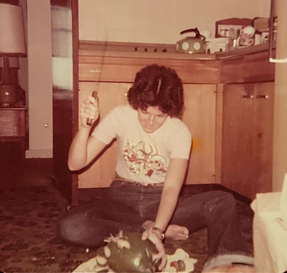 My sister Becky cutting open a coconut