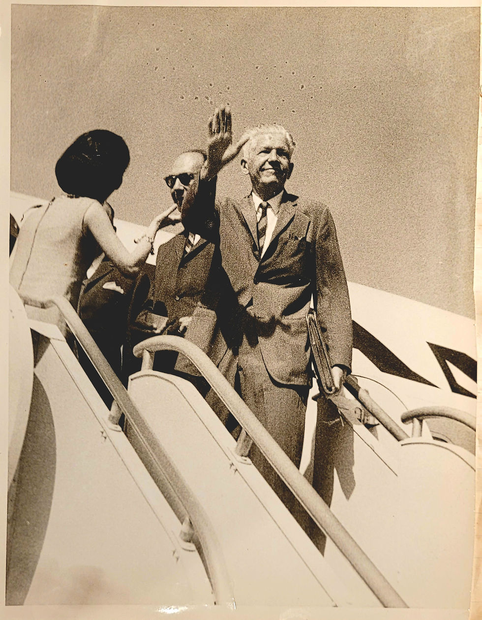 Dad, behind another passenger arriving from New York