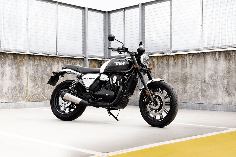 Black and white BSA Bantam parked on top of a building.