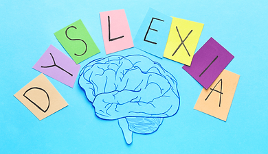 A brain with the word dyslexia written above it on colourful post-it notes