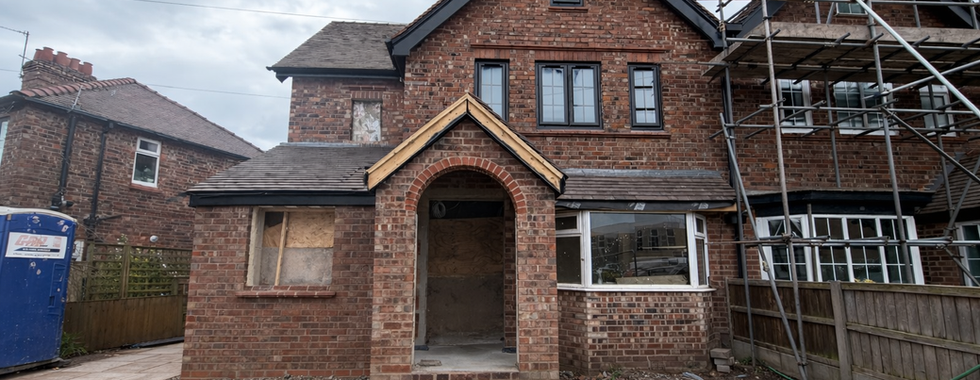 Exterior shot front of full house renovation with a double storey extension and loft conversion