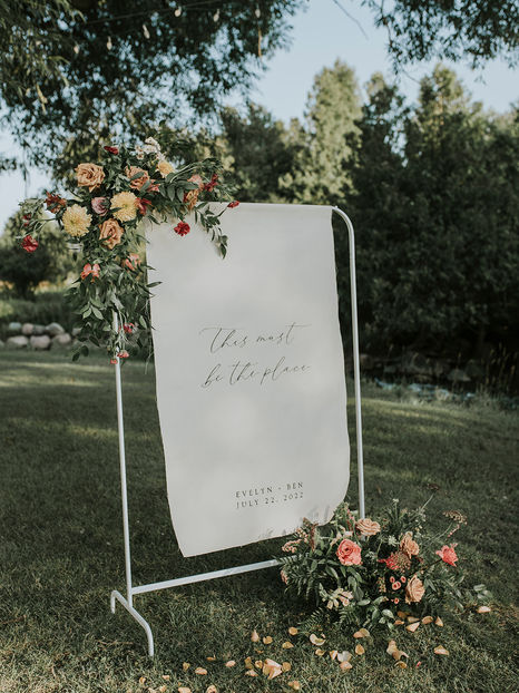 Custom fabric linen wedding welcome sign that says "this must be the place"