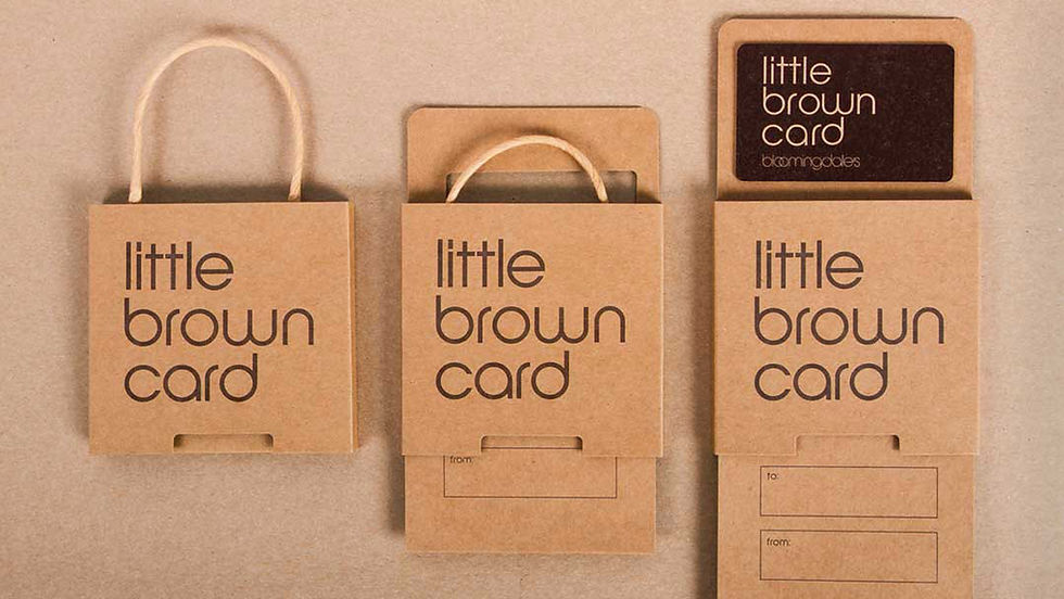 A brown sliding packaging
design for Bloomindales in
the style of a little brown
bag holding a gift card