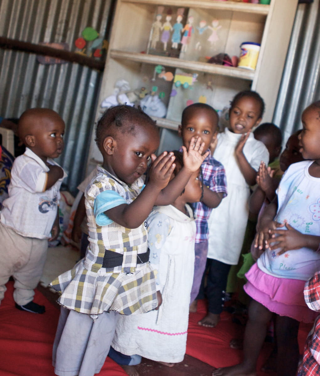 Toddlers praying and singing at daycare