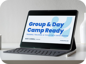 Laptop displaying “Group & Day Camp Ready” webinar slide with the subtitle “Training, Tracking, & Tools for a Safer Season.