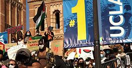 Pro-Palestinian protesters at the top of Janss Steps while others held a press conference at the bottom of the steps on the UCLA campus on May 1, 2024.(Genaro Molina / Los Angeles Times via Getty Images)
