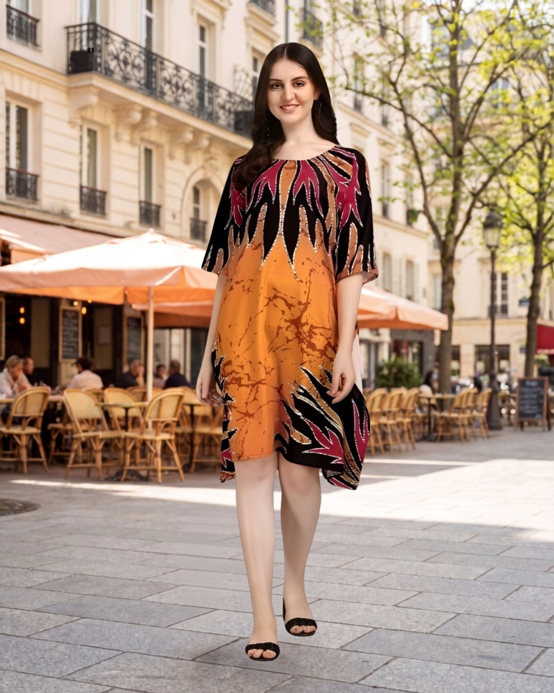 Model wearing kaftan outdoors near café with relaxed fit.