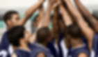 Arms Raised in Huddle