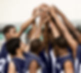 Arms Raised in Huddle